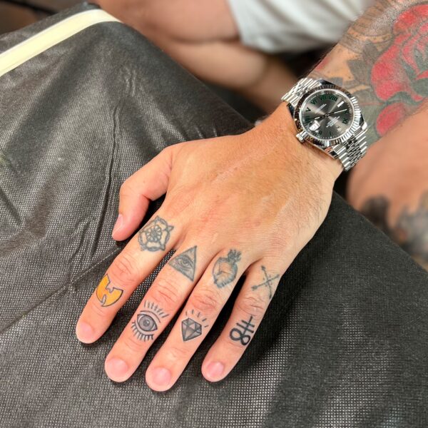 Zakk: Finger tattoos (upper healed, lower fresh)