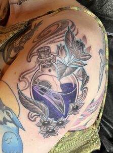 bird raven skull witchy potion tattoo